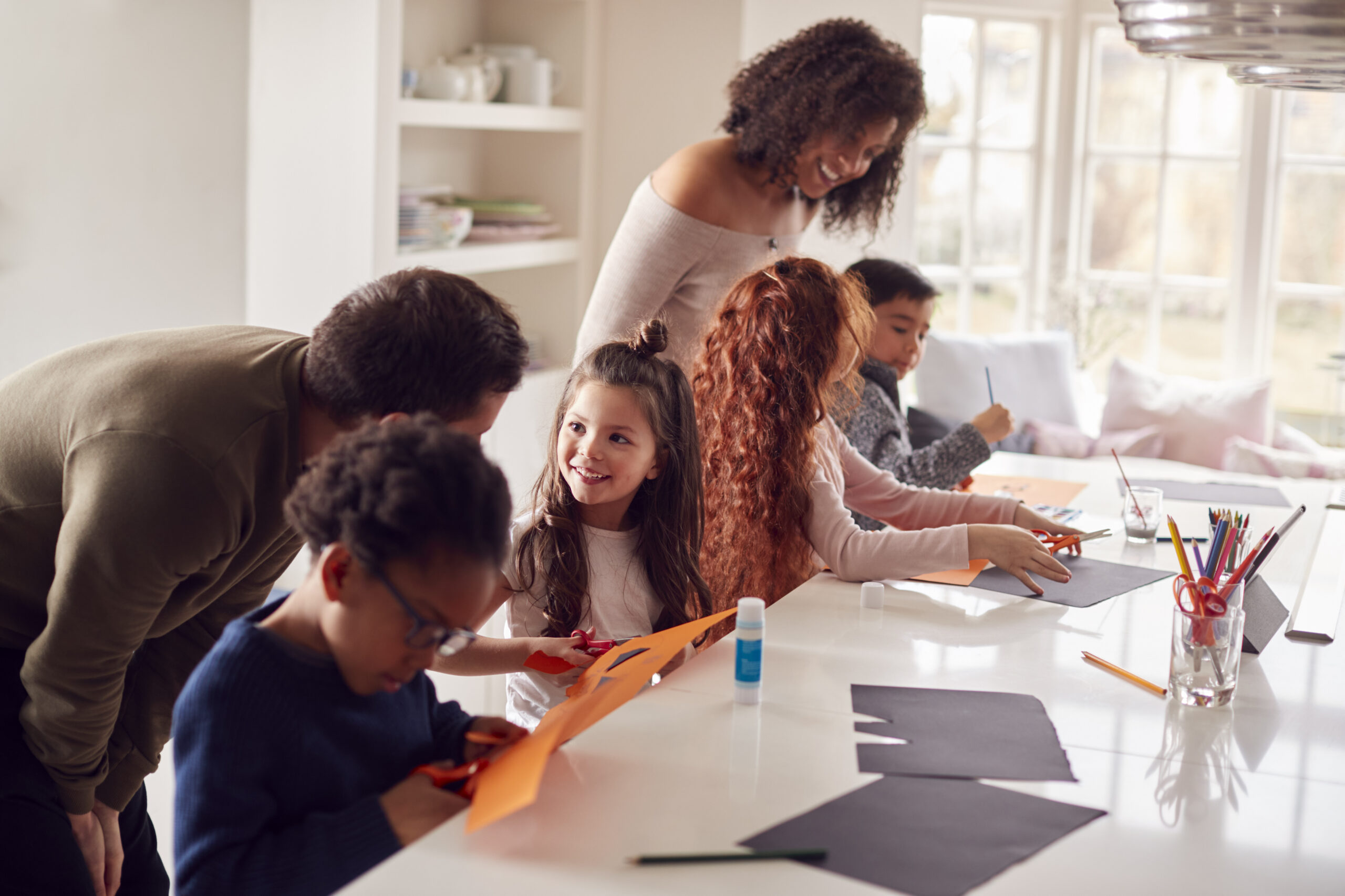Family doing arts and crafts together at home