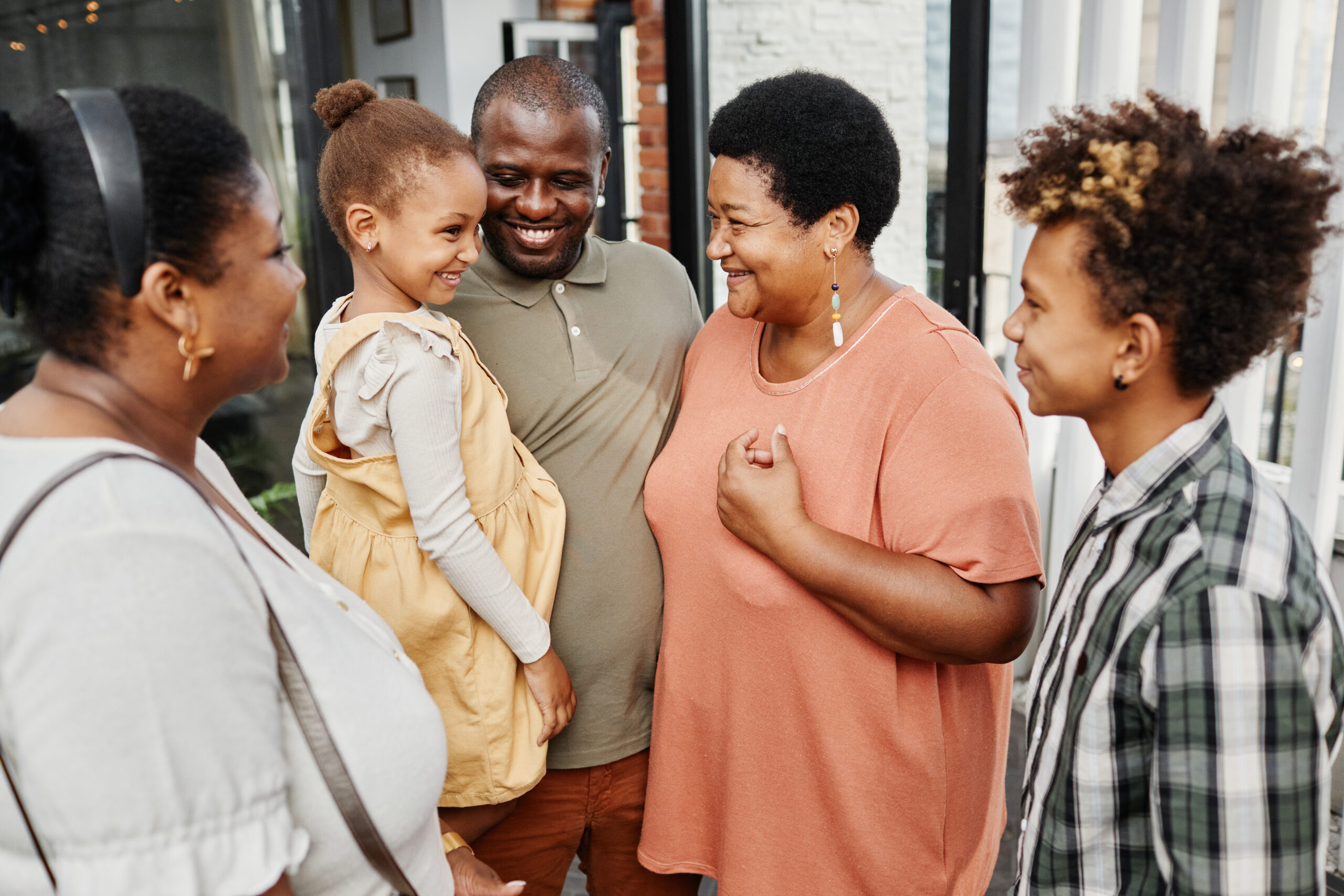 Family members smiling and talking together