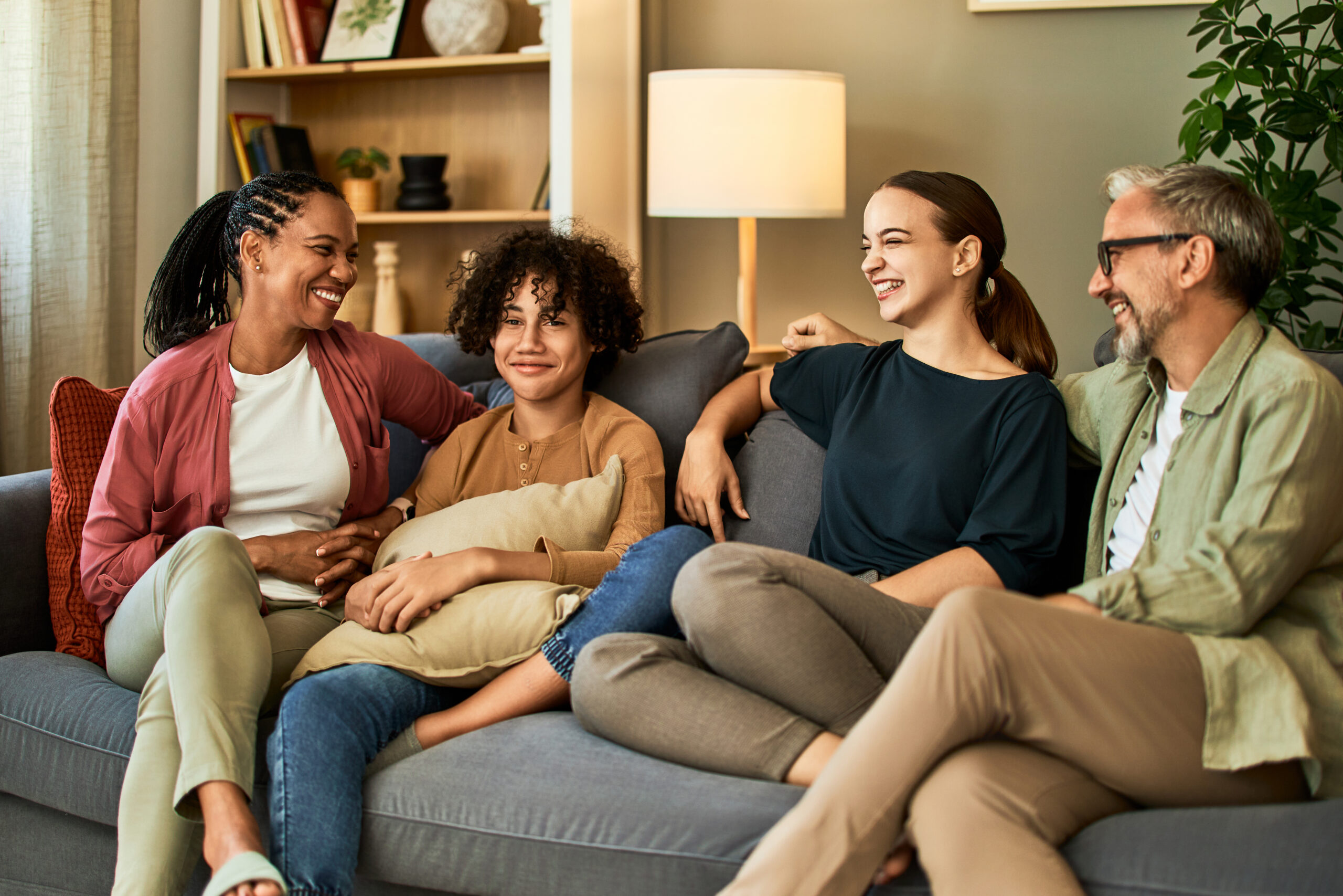 Family relaxing and talking together on a couch